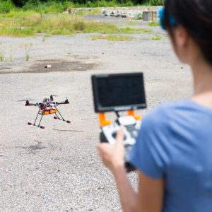 woman-playing-with-drone-2021-08-30-06-50-33-utc